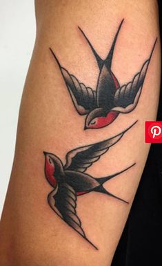 a couple of birds that are on the arm