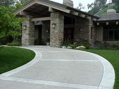 a house with a large driveway in front of it