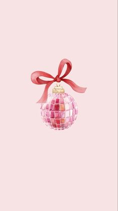 a pink christmas ornament with a red ribbon