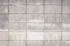 an image of a wall that looks like it is made out of cement blocks or bricks