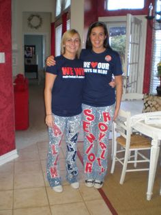 two women standing next to each other wearing matching pajama pants and t - shirts