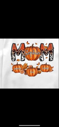 a white shirt with pumpkins and the word mom on it