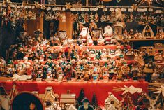 an assortment of christmas ornaments and figurines on display