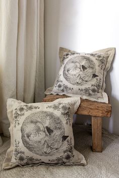 Two Hideaway Cushion placed in a hygge inspired cozy living room. Leaning on a wodden stool it gives a warm interior vibe. Silk Screen Printing, Back In Stock, For Everyone, Nursery