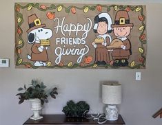 a happy friend's giving banner hanging on the wall