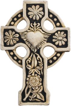 an ornate cross with hearts and flowers on the front, is shown in black and white