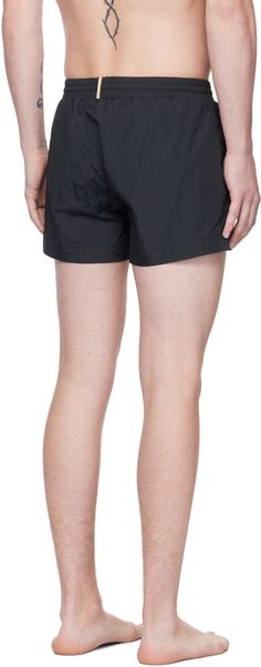 Quick-drying nylon taffeta swim shorts. · Drawstring at elasticized waistband · Two-pocket styling · Logo printed at front · Striped trim at back waistband · Mesh briefs-style lining Supplier color: Black Black Nylon Athletic Shorts For Beachwear, Black Nylon Shorts For Summer, Black Nylon Swim Trunks For Beachwear, Short Nylon Swim Trunks With Elastic Waistband, Black Nylon Swim Trunks For Poolside, Nylon Bottoms With Elastic Waistband For Poolside, Nylon Shorts For Poolside, Nylon Beachwear Bottoms With Pockets, Black Swim Trunks With Pockets For Poolside