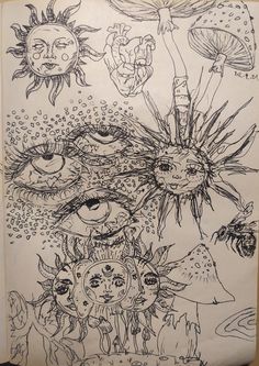 a drawing on paper with an eye in the center and other drawings around it,