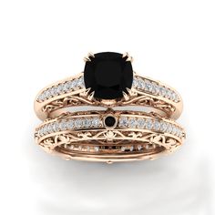 a black diamond engagement ring and wedding band set with diamonds in yellow gold plated silver