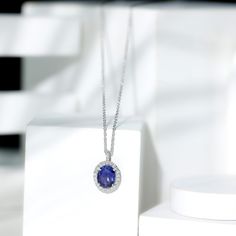 Product Details This elegant Drop Pendant Necklace is embellished with Oval Shape Lab Created Blue Sapphire secured in 4 Prong Setting while dainty Moissanite studded as Halo and sparkle on the bail.. The drop pendant design adds an elegant and elongating effect to the necklace, enhancing the neckline and adding a graceful touch to any outfit. Product Information SKU SHP-PENDANT032215692 Length 16.5 mm Width 11.2 mm Height 6 mm Weight 1.94 gm (Approximate) LAB CREATED BLUE SAPPHIRE INFORMATION N Brilliant Cut Tanzanite Necklace For Wedding, Fine Jewelry Tanzanite Necklaces For Wedding, Elegant Tanzanite Jewelry With Halo Design, Blue Sapphire Pendant, Drop Pendant Necklace, Halo Pendant, Sapphire Pendant, Signature Jewelry, Classic Jewelry