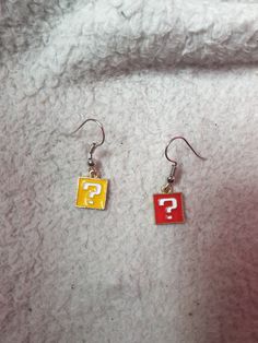 Question Block earrings perfect for video game fans who love Nintendo and the Mario franchise! Earring Video, Sound Machine, Super Mario Bros, Mario Bros, Super Mario, Video Game, Jewelry Earrings Dangle, Nintendo, Mario