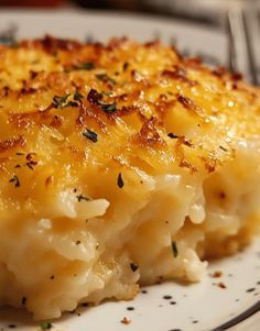 a white plate topped with macaroni and cheese