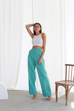 Women's high waisted palazzo pants are a style of wide-legged pants that sit at or above the natural waistline, creating a flattering and elongating effect on the body. They are typically made from lightweight and flowy fabrics, such as cotton, rayon, or chiffon, and come in a variety of colors, patterns, and prints. MATERIAL 50% viscose, 45% polyester, 5% elastane COLORS Black, Beige, Pink,Green,Blue, White, Mint WE OFFER TO UNPACK SUIT IN DIFFERENT SIZES Blaze and Pants (see the Variations) SIZES-LENGTH: XS size:  Pants-108cm S size: Pants-109cm M size: Pants-111cm L size: Pants-112cm We can customize bigger/smaller size/ length for you as well. Model on the Foto 171cm-67,3'', S size PRODUCT CARE  Professional dry-cleaning Feel free to contact us if you have any questions, doubts or comm Shoes With Palooza Pants, Chic Wide Leg Culottes With Loosely Fitted Hips, Chic Wide Leg Culottes, Elegant Summer Wide-leg Culottes, Chic Wide-leg Culottes For Summer, Chic Wide Leg Culottes For Summer, Chic Wide Leg Summer Culottes, Elegant Straight Culottes For Summer, Chic Wide Leg Cargo Pants