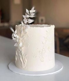 a close up of a white cake on a table