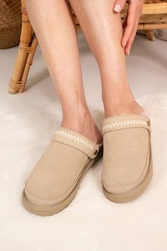 Introducing Hallie, your new favourite slipper crafted from 100% natural authentic sheepskin. This versatile slipper offers multiple ways to wear with its two detachable straps: a fluffy sheepskin statement band and an intricate tonal embroidered strap for a trendy look. Whether worn behind the ankle, for extra security, or over the front of the mule-style slipper, Hallie effortlessly blends comfort with style. The sheepskin lined interior ensures superior cosiness and comfort, making it ideal f Sheepskin Slippers, Embroidered Shoes, Stocking Fillers For Her, Forever Jewelry, Women's Slippers, Women Helping Women, Mens Jewelry Bracelet, Gifts For Mum, Inspirational Gifts