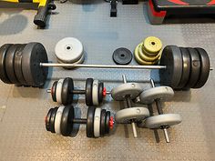 there are many different types of dumbbells on the floor