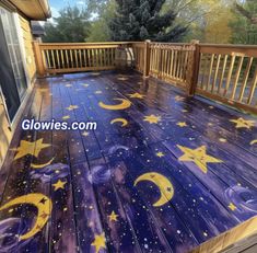 an outdoor deck painted with stars and moon designs