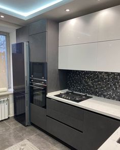 a modern kitchen with black and white decor