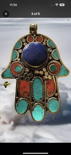 This beautiful and handmade Hamsa pendant is one of a kind,made by skilled artisan from Himalayan region Nepal. This stunning Hamsa Pendant is  inlay with Turquoise, coral and lapis stone set in Tibetan silver, Pendant size 3.3inches tall and weighs around 48 grams.( Note) listing price is per pendant.Great piece for a gift and add collection of your pendant from  Asia.If you have any issue with this purchase pls message me before leaving a negative review. I will try my best to solve the issue. Traditional Carved Blue Jewelry, Handmade Multicolor Lapis Lazuli Jewelry, Hand-strung Turquoise Pendant Jewelry, Hand-strung Turquoise Pendant, Turquoise Hand-strung Pendant, Spiritual Multicolor Hand-strung Turquoise Necklace, Tibetan Necklace Nepal, Lapis Stone, Hamsa Pendant