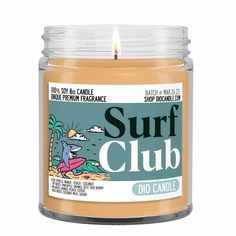 a candle that is sitting in front of a white background with the words surf club on it