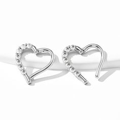 Description: Dainty and beautiful. These little heart earrings are perfect for an effortlessly chic look. This could be a fantastic gift for your loved ones, sister, mother, daughter, friend, wife, or girlfriend. Safe Material: The hoop ring is made of 14KT white gold, lead-free, and no nickel. Standard Size: The bar thickness is 16 gauge(1.2 mm), and the diameter is 8mm, 10mm. Please choose carefully according to your piercing size. Multiple Usage: It works well in multiple piercings like daith Elegant Heart-shaped Single Cartilage Earring, Heart-shaped Sterling Silver Single Cartilage Earring, Sterling Silver Heart-shaped Single Cartilage Earring, Sterling Silver Heart Cartilage Earrings, Sterling Silver Heart Cartilage Pierced Earrings, Silver Heart Cartilage Earrings As Gift, Elegant Silver Heart Piercings, Elegant Heart-shaped Cartilage Earrings As Gift, Elegant Heart Shaped Cartilage Earrings As Gift