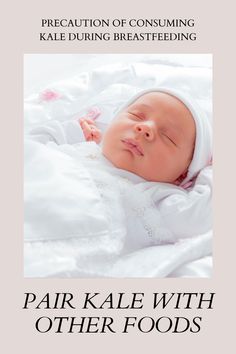 a baby laying on top of a white blanket