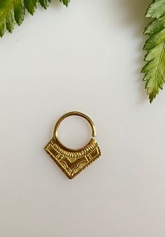 "African edgy piercing septum ring is inspired by the tribal Tuareg jewelry. The ethnic triangle nose ring will add statement detail to your boho outfit. Each piece is hand made and hand carved to offer a unique piece to adorn yourself. Material: brass Gauge 18 oooooooooo See more here : https://www.etsy.com/shop/Saajie oooooooooo ✩ WRAPPING ✩ Gift- Ready !! ✩ Your septum ring will come in a beautiful handmade cotton and recycled silk from Indian Saree pouch. Ideal for gifts or just storing your Ethnic Nose, Triangle Nose, Tuareg Jewelry, Septum Hoop, Piercing Septum, Boho Outfit, Indie Jewelry, Septum Jewelry, Sterling Silver Bangle Bracelets