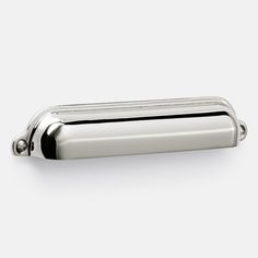 a chrome door handle on a white background