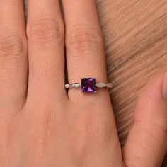 It is a natural amethyst ring, princess cut, measures 6mm*6mm, weight about 1.03 cts. The basic metal is sterling silver and plated with rhodium. To change the metal to a solid gold (white/rose) or platinum is also available, please ask for a quotation if you want. You can also go to my shop Home for more elegant rings: https://www.etsy.com/shop/godjewelry?ref=hdr_shop_menu amethyst is the birthstone of February. More amethyst rings: https://www.etsy.com/shop/godjewelry?ref=seller-platform-mcnav Promise Princess Cut Birthstone Ring, Purple Emerald-cut Birthstone Ring For Anniversary, Princess Cut Jewelry With Accent Stones, Square Cut Amethyst Ring For Anniversary, Purple Square Cut Jewelry For Gifts, Elegant Amethyst Princess Cut Ring For Anniversary, Princess Cut Amethyst Gemstone Jewelry, Elegant Princess Cut Amethyst Ring For Anniversary, Anniversary Square Cut Amethyst Ring