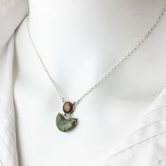 "A lovely sterling silver necklace of bezel set Smokey Quartz and a Wyoming jade crescent moon. Wyoming Jade is also known as rhyolite. The pendant is 3/4\" inch in length. The cable chain is 16\" inches long and has a four inch extension chain making it 20\" inch. Dimensions: Top cabochon is 7mm, bottom Wyoming jade width is 14mm. Full length 16-20\" inch. Spring ring clasp. Matching earrings can be found here: Excited to share this item from my #etsy shop: Wyoming Jade Dance Stud Earrings in S Silver Crescent Gemstone Necklace, Artisan Crescent Jewelry Nickel Free, Nickel Free Sterling Silver Crescent Necklace, Silver Crescent Necklace With Natural Stones, Crescent Natural Stones Jewelry As Gift, Crescent Natural Stone Jewelry As A Gift, Crescent Natural Stones Jewelry Gift, Crescent-shaped Natural Stones Jewelry As Gift, Crescent-shaped Natural Stones Jewelry Gift