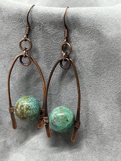 handmade earrings featuring jasper in a teal color with copper settings, unique and beautiful Artisan Jewelry With Natural Stones And Copper, Artisan Copper Jewelry With Natural Stones, Copper Dangle Jewelry With Natural Stones, Handmade Bohemian Jasper Jewelry, Dangle Jasper Jewelry With Natural Stones, Bohemian Jasper Dangle Jewelry, Unique Copper Dangle Jewelry, Artisan Jasper Teardrop Jewelry, Natural Jasper Stone Dangle Jewelry