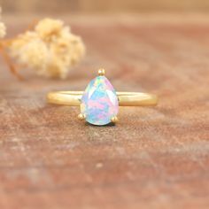 Genuine white fire opal ring, Spiritual opal ring for someone special, October birthstone opal jewelry, Minimalist ring, ring for women, fire opal jewelry. *Other Similar Jewelry Available Here* https://www.etsy.com/shop/AreebaJewelry Details:- Gemstone - Ethiopian opal  Stone Color - Natural  Stone Setting - Prong Quality - AAA Grade Rize Size - 4 US TO 9 US Available Type - 100% Natural  Shipping service - Free worldwide shipping service About AreebaJewelry:- AreebaJewelry takes great pride in Teardrop Opal Ring As A Gift, Fine Jewelry Opal Rings In Pear Shape, Anniversary Solitaire Opal Ring, Pear-shaped Opal Rings Fine Jewelry, Opal Open Ring Birthstone, Pear-shaped Opal Gemstone Ring, Ethiopian Opal Promise Ring Birthstone, Ethiopian Opal Birthstone Promise Ring, Solitaire Opal Ring In Round Shape