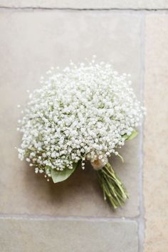 a bouquet of baby's breath on the ground