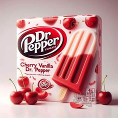 a box of dr pepper popsicles with cherries on the side and one in front