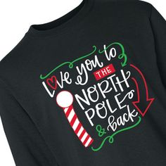 This shirt is definitely on Santa's nice list! Printed with "Love you to the North Pole & back," this youth T-shirt is a holly, jolly choice for holiday events and family Christmas photos. Your little elf will look cute as a button wearing this comfy Christmas T-shirt. The red, white and green design features a swirly font, a striped pole and fun accent shapes. © OTC

o Fits sizes 6-8
o Brand: Gildan
o Long sleeve
o Preshrunk 100% polyester with cotton feel, 5.3 oz. 
o Seamless three-qu Popular Christmas Shirts, Swirly Font, Family Christmas Photos, Comfy Christmas, Christmas Pj, Christmas Apparel, Christmas Tee Shirts, Christmas Jammies, Christmas T Shirt Design