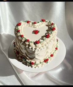 a heart shaped cake on a white plate