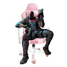 a man sitting on top of a pink chair