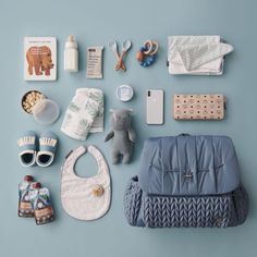 baby items laid out on a blue surface