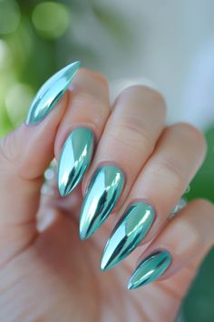 Hand with long, shiny, metallic aqua blue stiletto nails. Metalic Chrome Nail, Jewel Tone Chrome Nails, Summer 2024 Chrome Nails, Like Green Chrome Nails, Chrome Nails Green And Purple, Chrome Nail Designs, Red Chrome Nails, Bow Nail Designs, Bow Nail Art