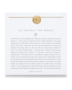 a gold bracelet with the words us against the world on it