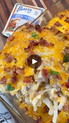 a casserole dish with meat, cheese and onions