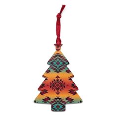 a colorful christmas tree ornament hanging from a red ribbon