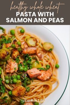 pasta with salmon and peas on a white plate