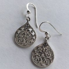 Magic moments These are pretty classy silver earrings. The earrings are not heavy and very comfortable to wear. E8002 © 2011-2015, Artisanimpact Inc. All rights reserved. Construction & Dimensions: sterling silver. Approximate width: 15mm (0.27in), height 31mm (0.59in). About our jewelry Artisanlook offers an exciting collection, designed and made by artisanimpact inc, especially for occasions: wedding, engagement and cocktail. You will find a selection of rich spinner rings, gold diamond ri Silver Filigree Teardrop Earrings For Gift, Elegant Sterling Silver Filigree Teardrop Earrings, Silver Teardrop Earrings With Intricate Design, Earrings Casual, Shiny Earrings, Easy Magic, Magic Moments, Casual Earrings, Classic Earrings