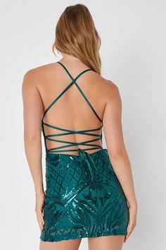 You'll stop everyone in their tracks when you arrive on the scene in the Lulus Undeniably Amazing Emerald Green Sequin Lace-Up Mini Dress! Glittering sequins create an intricate design as they dance across sheer mesh knit that shapes a notched neckline with V-bar support and a padded bodice. A figure-flaunting silhouette falls to a sexy mini hem while satin straps lace up across the open back design. Hidden back zipper/clasp. Fit: This garment fits true to size. Length: Mid-thigh. Size medium me Backless Sequin Mini Dress For Holiday Party, Backless Mini Dress With Sequins For Holiday Party, Holiday Sequin Fabric For Homecoming, Green Mini Sequin Dress For Prom, Sequin Dress With Strappy Back For Prom, Sequin Fabric For Homecoming And Party Season, Glamorous Green Sequin Dress For Homecoming, Glamorous Green Sequin Homecoming Dress, Glamorous Party Mini Dress With Lace-up Back