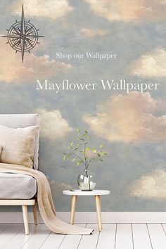 a living room with a couch, table and wallpaper that says mayflower wallpaper