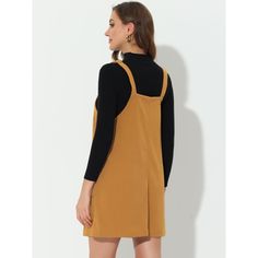 This dress is so versatile and can be worn over tops, shirts, or sweaters to create a charming look. It's perfect for weekdays at work, date nights, shopping trips, and daily life. You can style it with boots for a ready-to-go look. The dress features a simple and classic design with an above-knee length and a-line silhouette. It also has adjustable shoulder straps, two front pockets, a button-down closure, and a suspender dress. Casual Fall Pinafore Dress For Workwear, Casual Pinafore Dress For Work, Casual Long Sleeve Pinafore Dress, Casual Brown Pinafore Dress For Fall, Pinafore Dress With Buttons For Workwear, Casual Cotton Pinafore Dress For Fall, Casual Brown Pinafore Dress For Spring, Casual Fall Pinafore Dress, Spring Workwear Pinafore Dress With Buttons