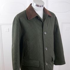 This olive green wool coat has features subtle diamond-shaped quilt-like topstitching and a brown collar. The handsome 1990s Italian vintage overcoat closes in the front with five faux tortoiseshell buttons and is fully lined in a shimmering dichroic red and green satin polyester fabric. Note that this is a short size, as indicated by the sleeve length measurement and length of coat listed below. Brand Label: Tuscan Square (Made in Italy) Size: 44S US/UK Material: Wool Chest = 47 inches (119.38c Classic Quilted Jacket With Button Closure, Classic Olive Outerwear With Button Closure, Classic Quilted Jacket With Buttons, Classic Olive Outerwear For Business, Vintage Overcoat, Green Wool Coat, Long Overcoat, Brown Tweed, Length Measurement