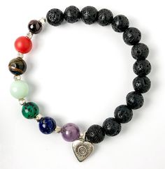 Semi-precious Gemstone 7 Chakra Bracelet, Hill Tribes Fine Silver Heart Charm, Lava Stone Bracelet, 8mm Beads, Handcrafted in CA.This lovely Chakra bracelet is handcrafted with 8mm lava & semi-precious gemstone beads, Hill Tribes high-purity fine silver heart charm, and Sterling Silver spacers. The stones in this bracelet for each Chakra are:• Amethyst for Crown• Lapis Lazuli for Third-Eye• Turquoise for Throat• Amazonite for Heart• Tiger Eye for Solar Plexus• Carnelian for Sacral• Garnet for Ro Spiritual Heart Beads Bracelet Gift, Spiritual Multicolor Heart Bracelets, Spiritual Multicolor Heart-shaped Bracelets, Healing Charm Bracelet With Natural Stones And Round Beads, Spiritual Beaded Bracelets With Heart Charm As Gifts, Spiritual Heart Beads Bracelet, Heart-shaped Natural Stone Beaded Bracelets For Gifts, Heart-shaped Natural Stone Beaded Bracelets As Gift, Heart-shaped Healing Beaded Bracelets