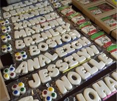 there are many decorated cookies on display for sale at the store's counter top